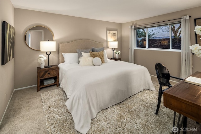 bedroom with carpet floors and baseboards