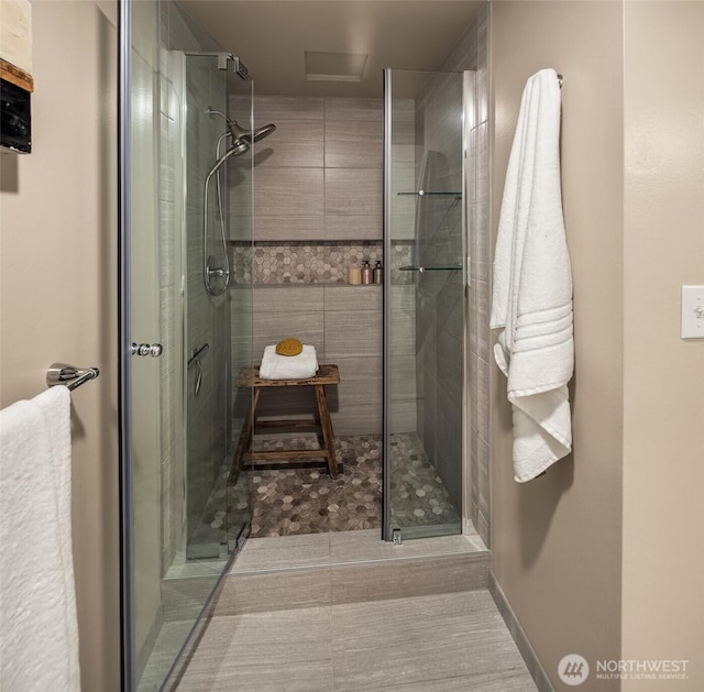 full bathroom featuring a stall shower