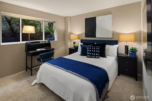 carpeted bedroom featuring baseboards