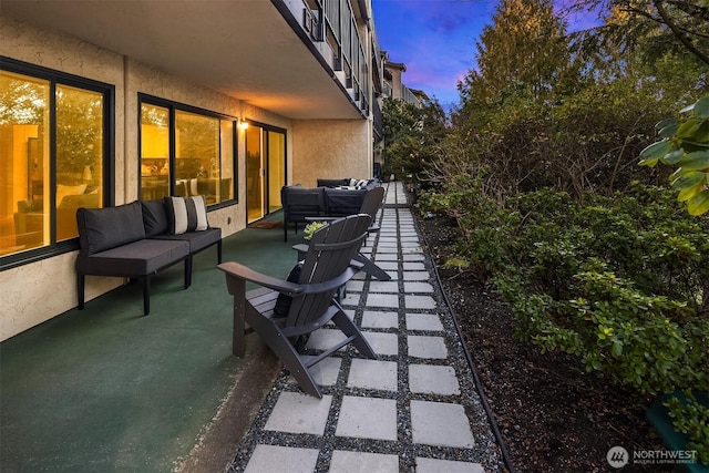 patio terrace at dusk with an outdoor hangout area