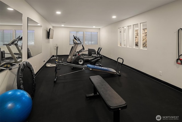 exercise room featuring baseboards and recessed lighting