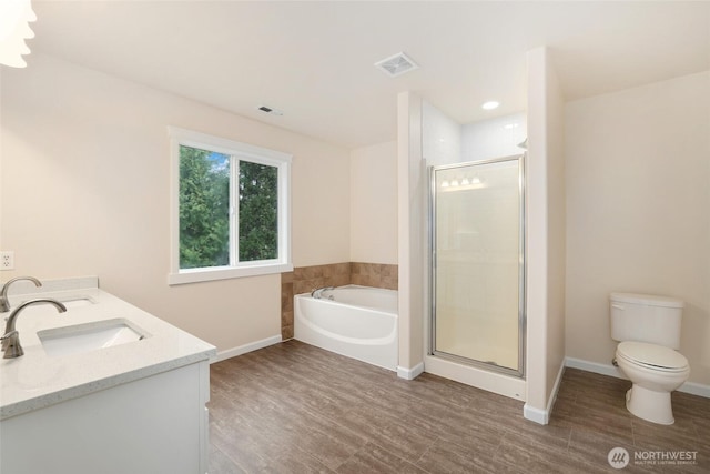 full bath featuring visible vents, a garden tub, toilet, a sink, and a shower stall