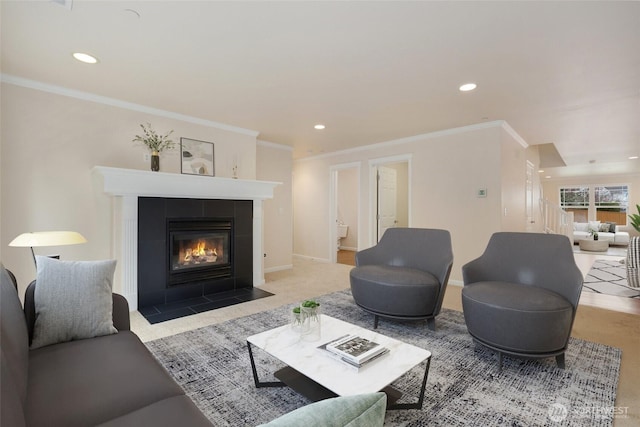 living area with recessed lighting, a fireplace, baseboards, and ornamental molding