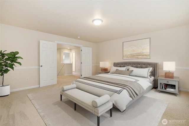 bedroom with light colored carpet and baseboards