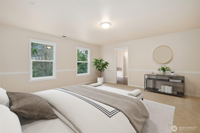 bedroom featuring visible vents and baseboards