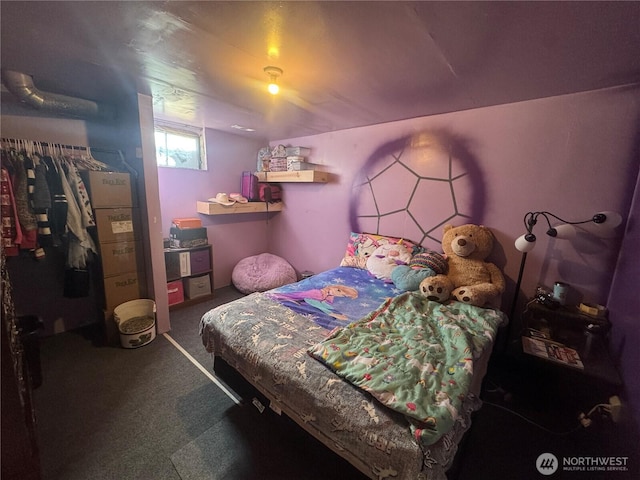 bedroom with a closet and carpet