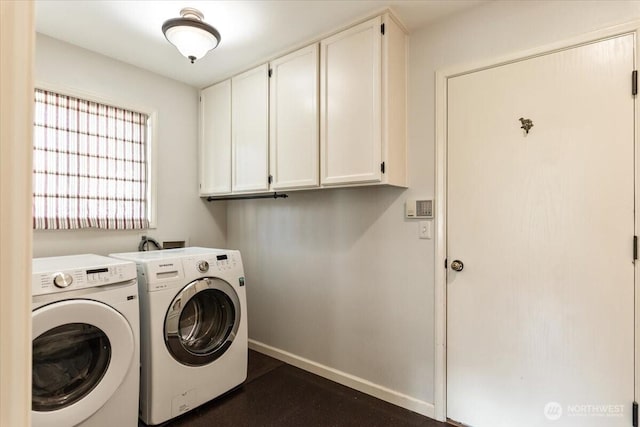 washroom featuring cabinet space, independent washer and dryer, and baseboards