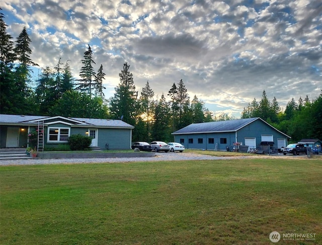 exterior space with a garage and a yard