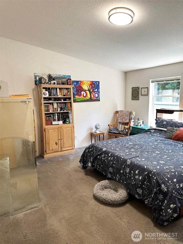 carpeted bedroom with a textured ceiling