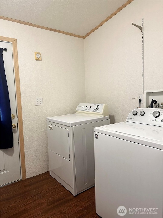 washroom with crown molding, laundry area, dark wood finished floors, and washer and clothes dryer