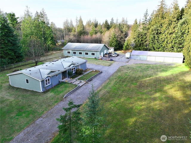 birds eye view of property with a forest view