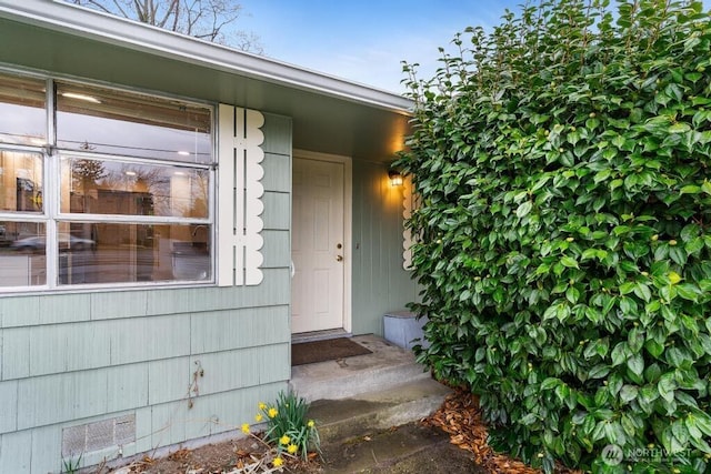 doorway to property featuring crawl space