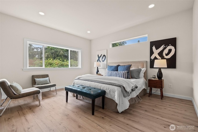 bedroom with light wood-style floors, recessed lighting, and baseboards