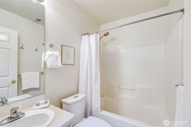9418 NE Tidal Ct, Bainbridge Island, WA 98110 - bathroom featuring vanity, shower / bath combo, toilet, and visible vents