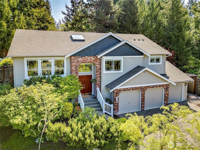 9418 NE Tidal Ct, Bainbridge Island, WA 98110 - bi-level home with fence, roof with shingles, and brick siding