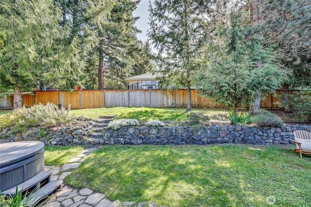 9418 NE Tidal Ct, Bainbridge Island, WA 98110 - view of yard with a fenced backyard and a hot tub