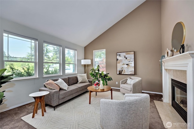9418 NE Tidal Ct, Bainbridge Island, WA 98110 - carpeted living room featuring a high end fireplace, high vaulted ceiling, and baseboards
