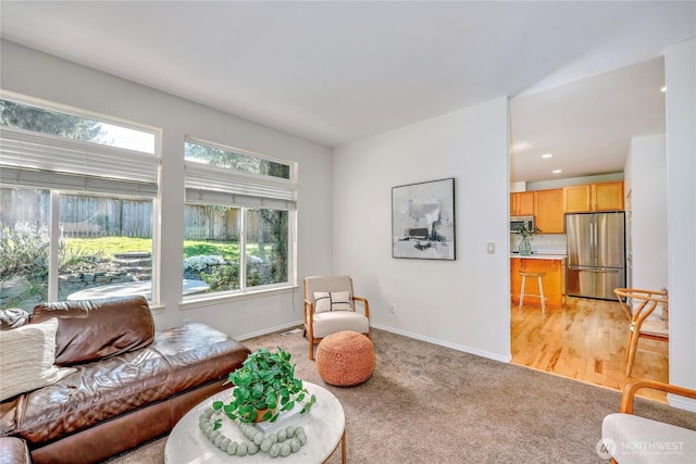 9418 NE Tidal Ct, Bainbridge Island, WA 98110 - living room featuring baseboards and light carpet