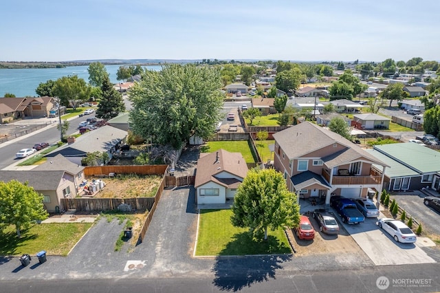 aerial view with a water view and a residential view