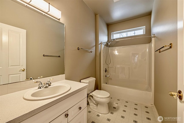 bathroom with tile patterned floors, vanity, toilet, and bathing tub / shower combination