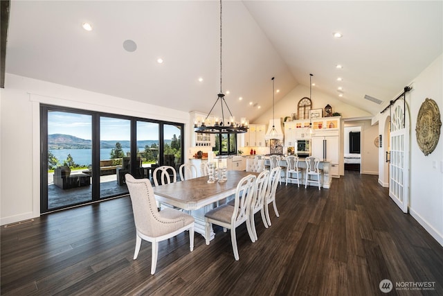 dining room with baseboards, visible vents, dark wood finished floors, an inviting chandelier, and high vaulted ceiling