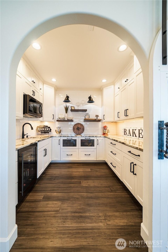 storage area with beverage cooler and a sink