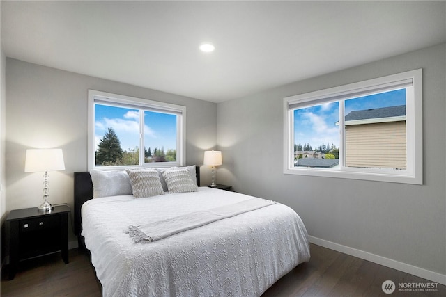 bedroom with recessed lighting, baseboards, and wood finished floors