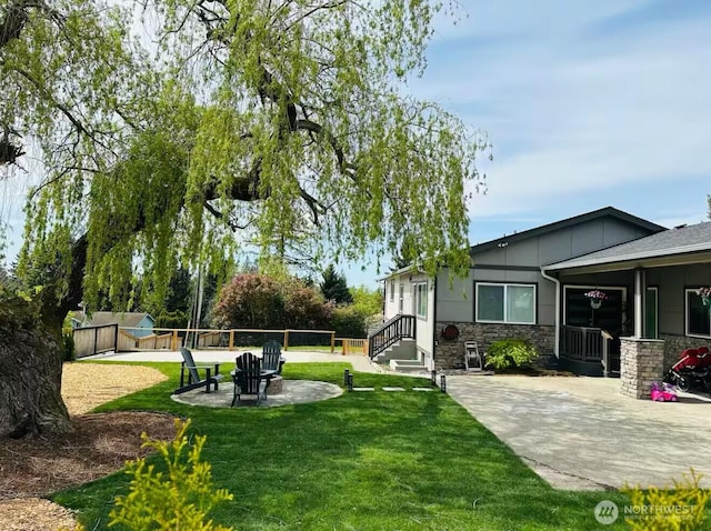 view of yard featuring a patio area and fence