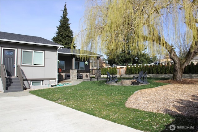 view of yard with a patio and fence