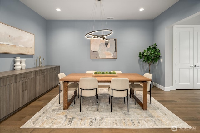 dining room featuring recessed lighting, baseboards, and wood finished floors