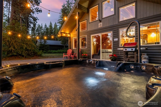 exterior space featuring a patio area and faux log siding