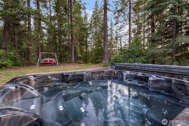 view of pool featuring a hot tub