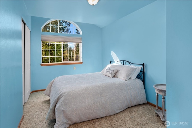 carpeted bedroom featuring baseboards