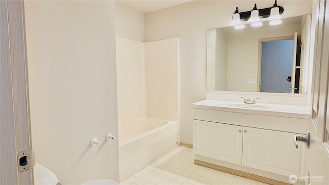 full bath with tile patterned flooring, bathtub / shower combination, vanity, and toilet