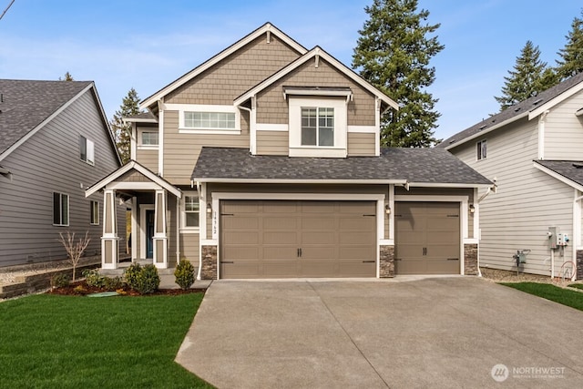 craftsman-style house with stone siding, a front lawn, and driveway