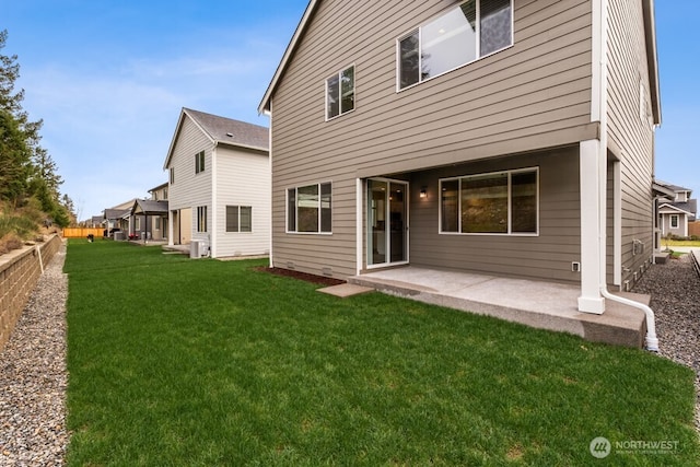 back of house featuring a patio, a yard, and fence