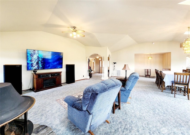 176 Fager Hill Rd, Port Townsend, WA 98368 - living area with lofted ceiling, carpet, arched walkways, ceiling fan, and a chandelier