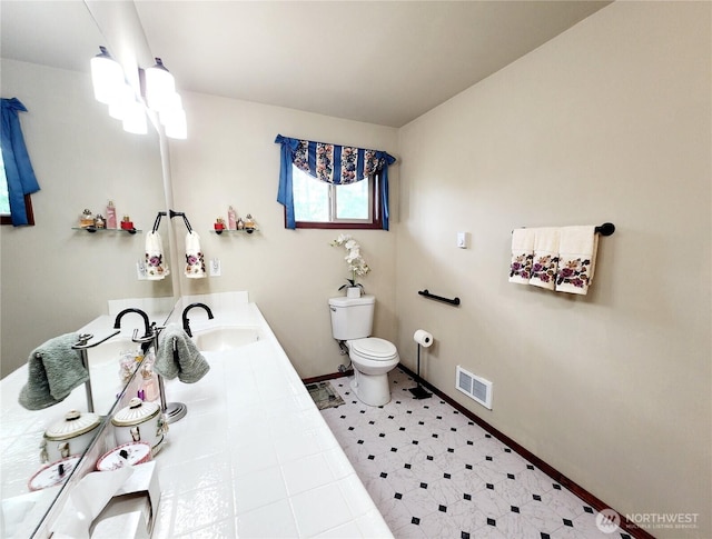 176 Fager Hill Rd, Port Townsend, WA 98368 - bathroom featuring toilet, baseboards, and vanity