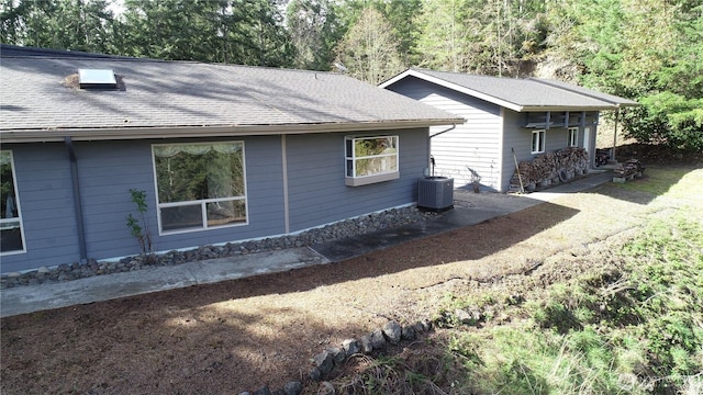 176 Fager Hill Rd, Port Townsend, WA 98368 - view of home's exterior with central AC unit and roof with shingles