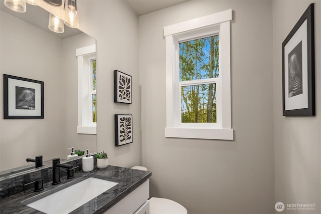 bathroom with vanity and toilet