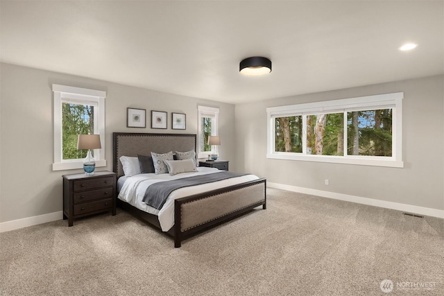 bedroom with carpet, visible vents, baseboards, and recessed lighting