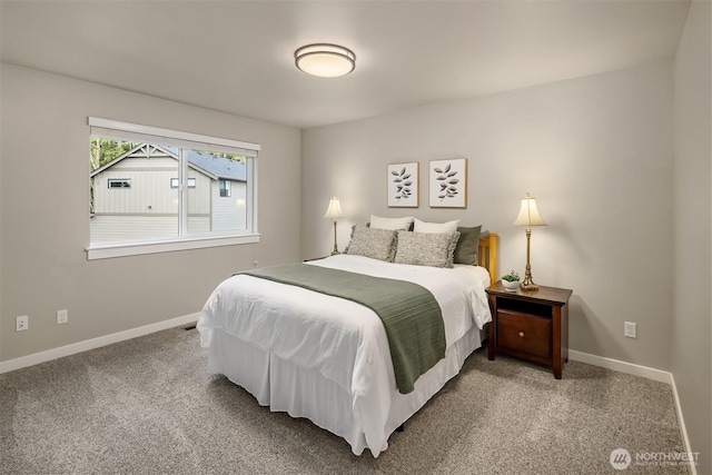 bedroom featuring carpet flooring and baseboards