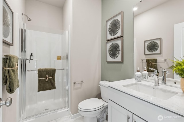 bathroom with toilet, marble finish floor, a shower stall, and vanity