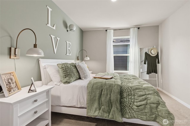 bedroom with carpet floors and baseboards