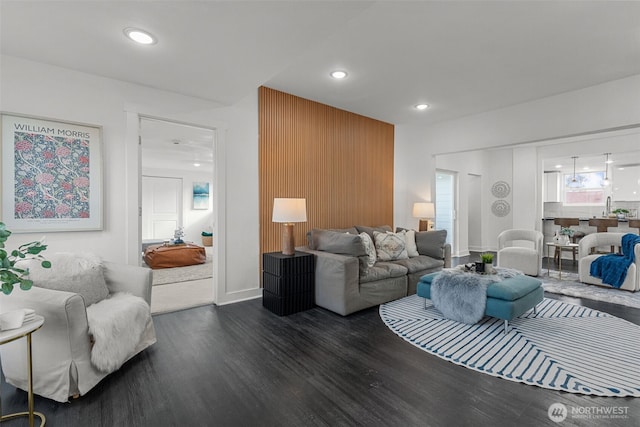 living area with dark wood finished floors and recessed lighting