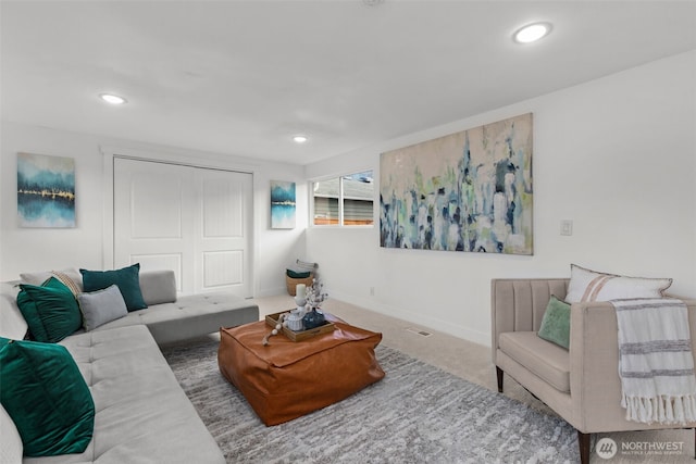 living room featuring baseboards, carpet, and recessed lighting