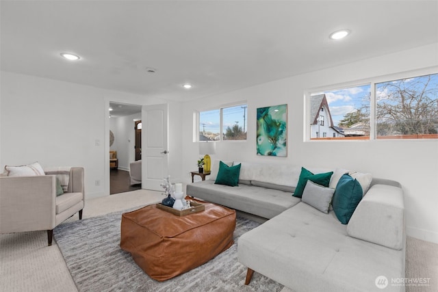 carpeted living room with baseboards and recessed lighting