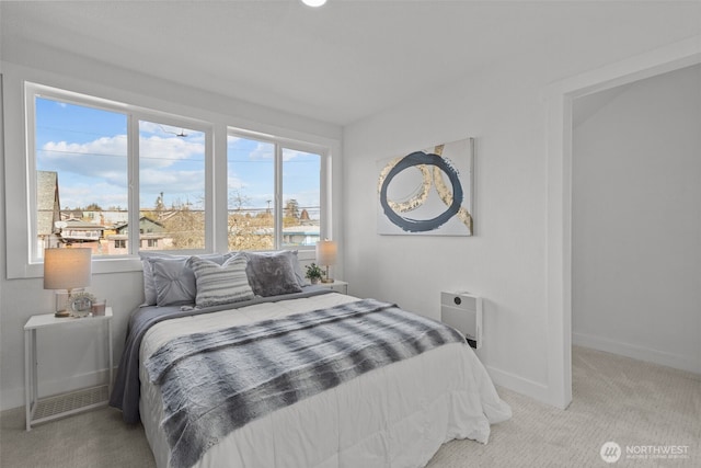 bedroom with carpet and baseboards