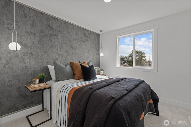 carpeted bedroom with baseboards