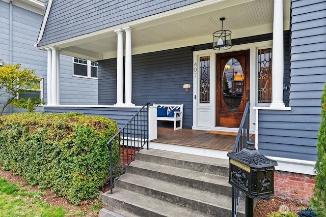 property entrance featuring a porch